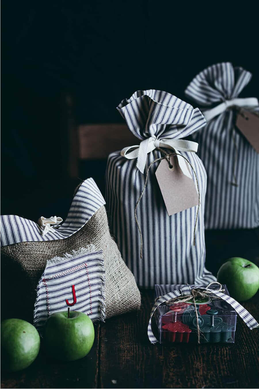Use fabric gift sacks for wrapping paper