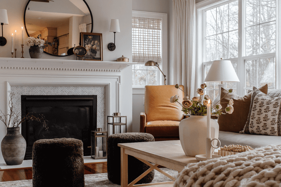 A winter white living room with a caramel leather chair