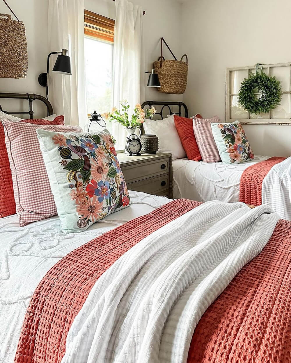 In the love of home files #19, this is a bedroom with twin beds and checked and floral pillows.