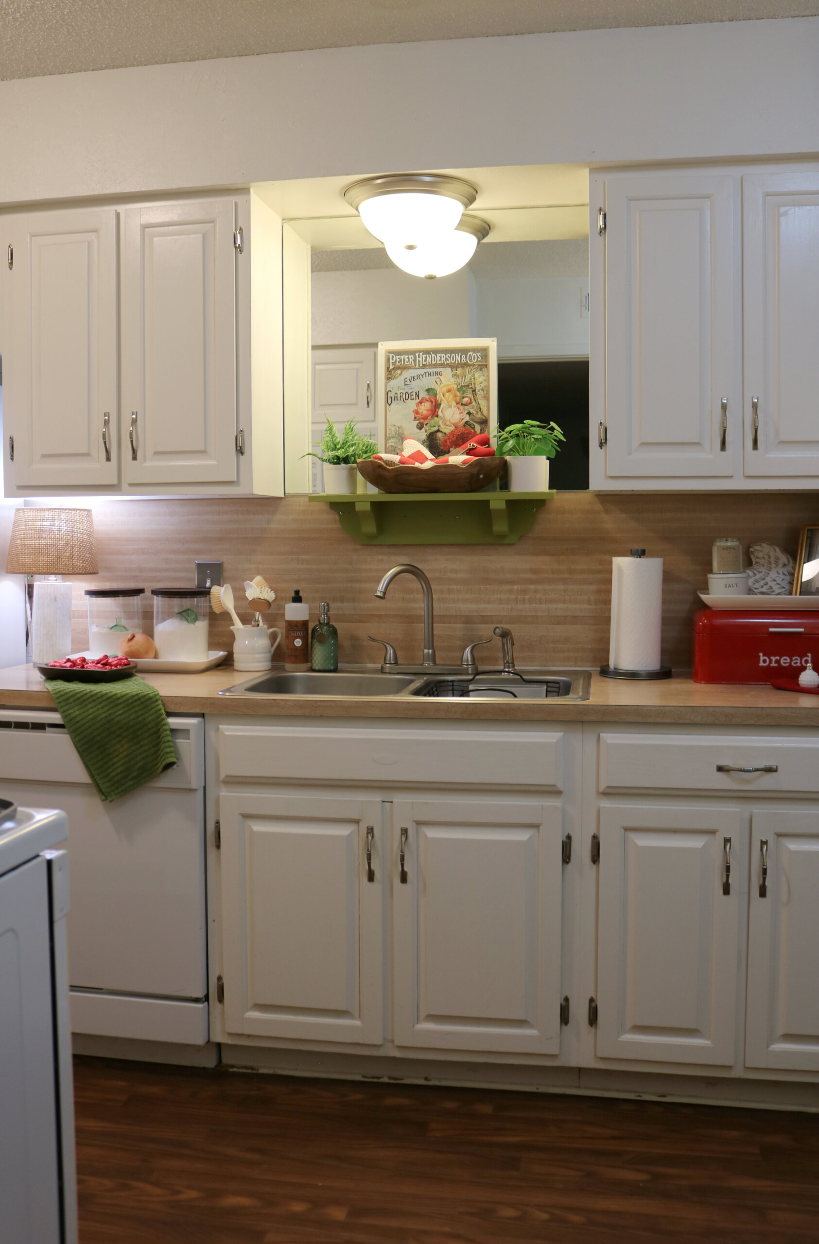 The wall of my kitchen with the sink along with Valentine's Day decor