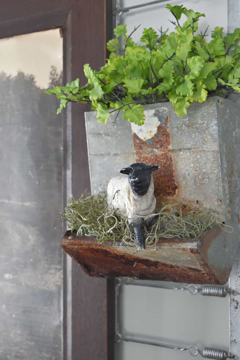 Vintage chicken feeder with faux grass and a lamb