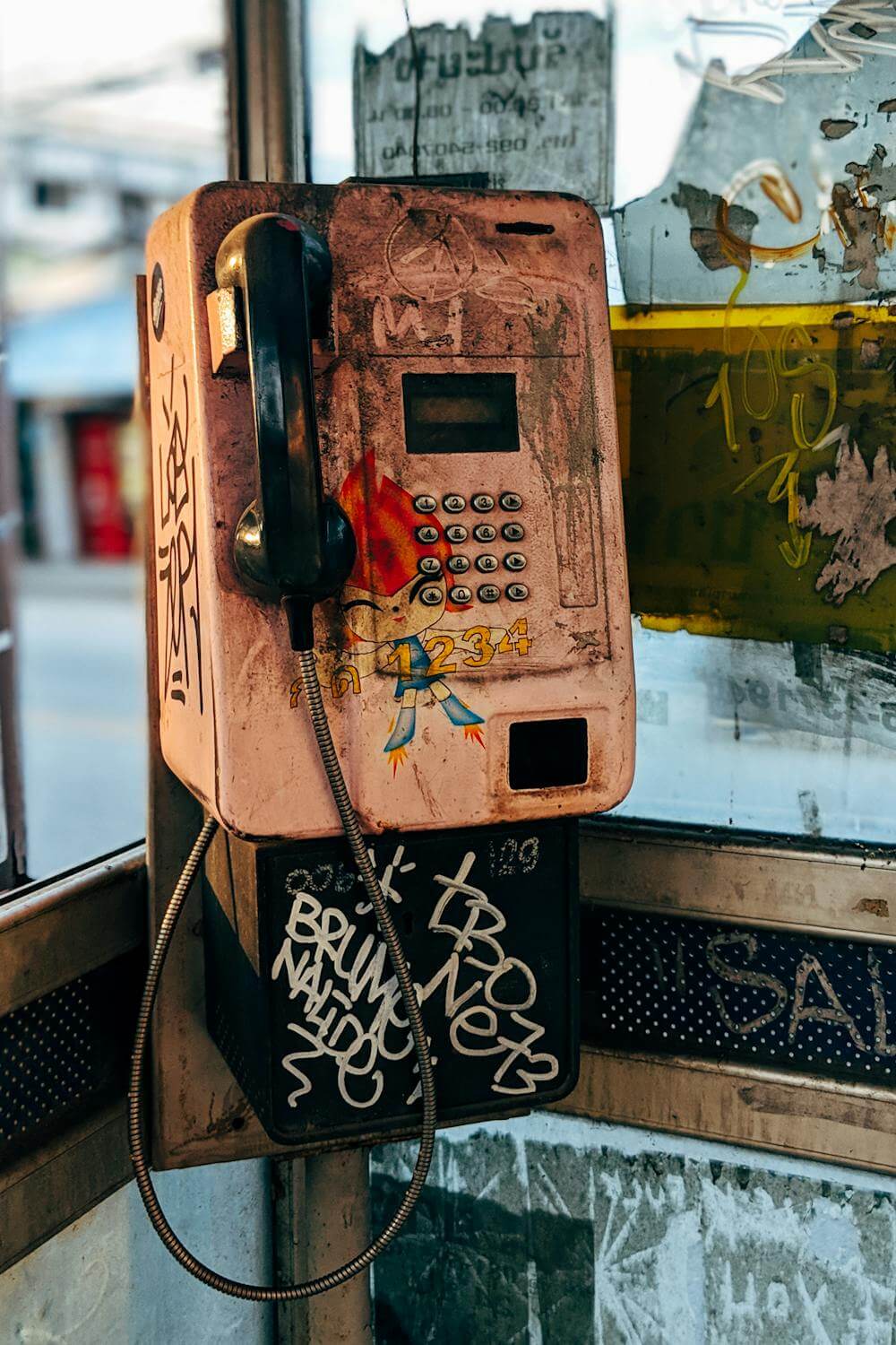 Phone booth with graffiti