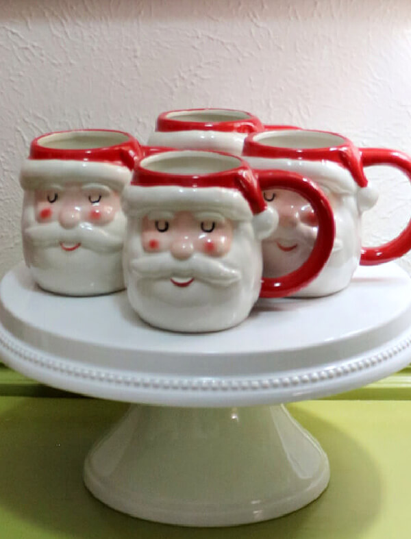 Deck the Halls with Santa Mugs with a group on a white cake plate.