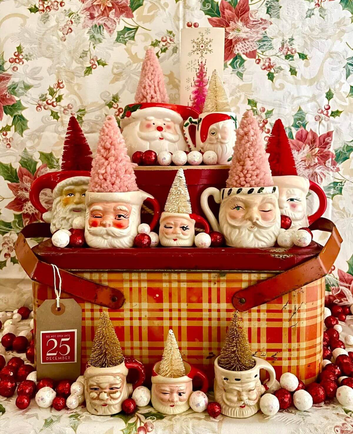 Deck the Halls with Santa Mugs on a vintage plaid picnic basket.