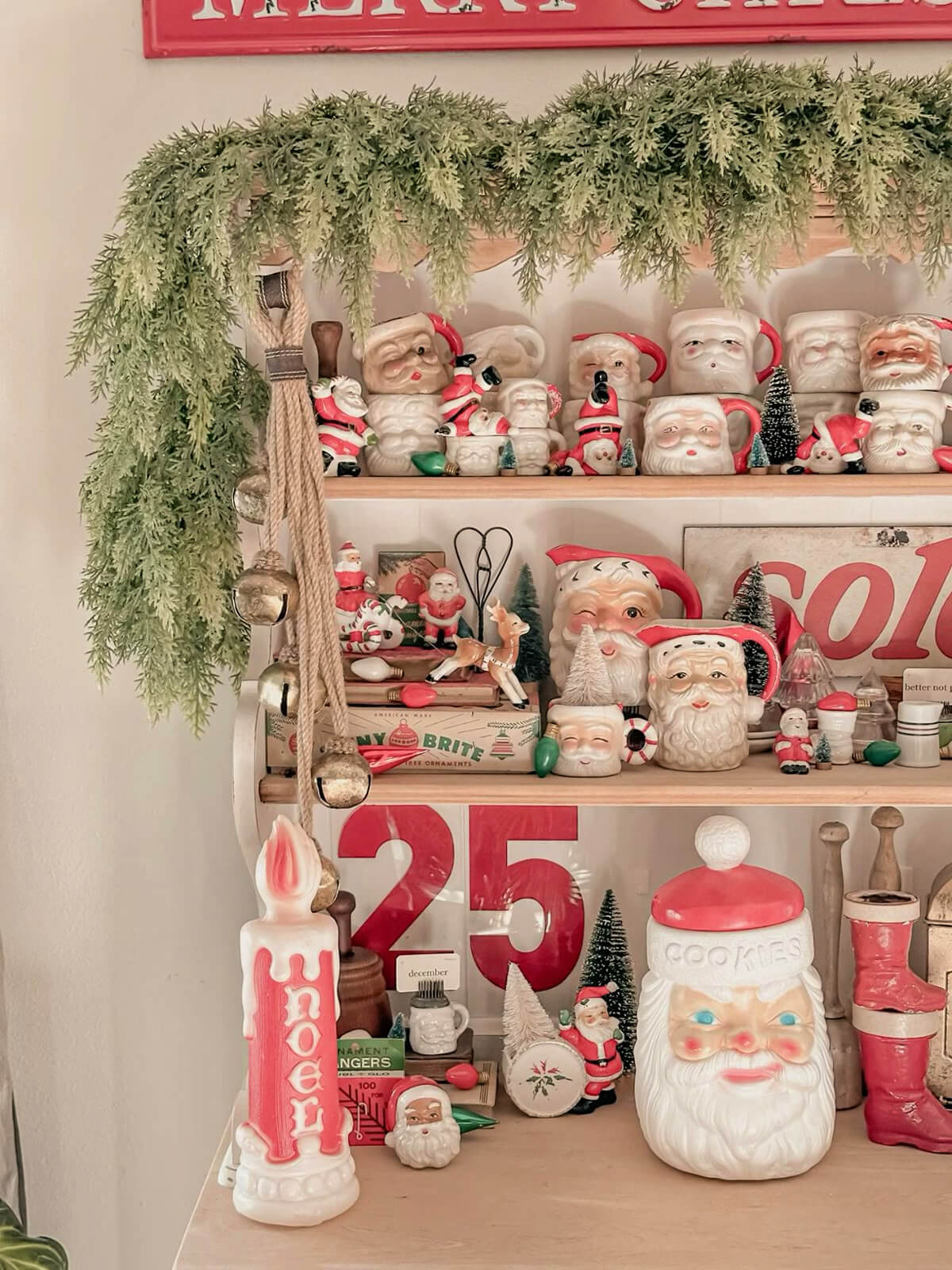 Deck the Halls with Santa Mugs lined up on shelves.
