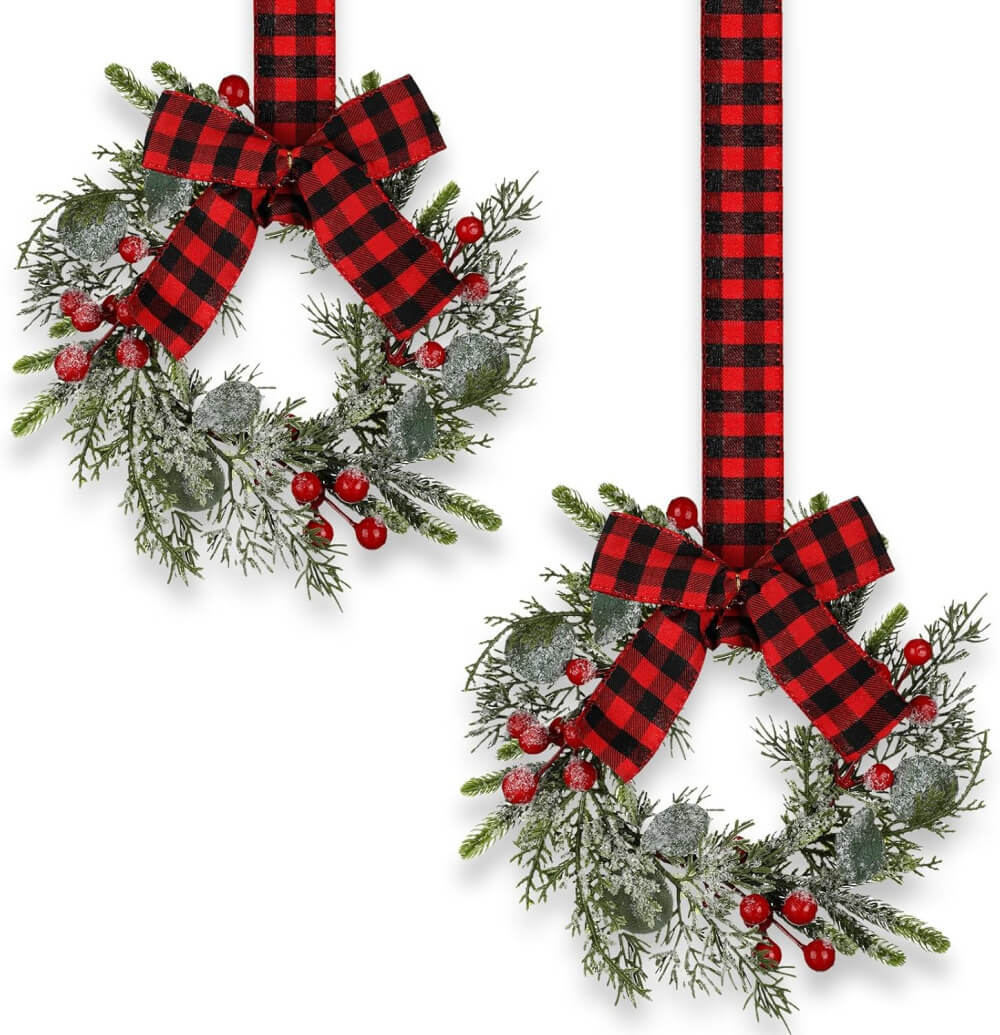 Amazon wreaths with red berries and red and black plaid ribbon.