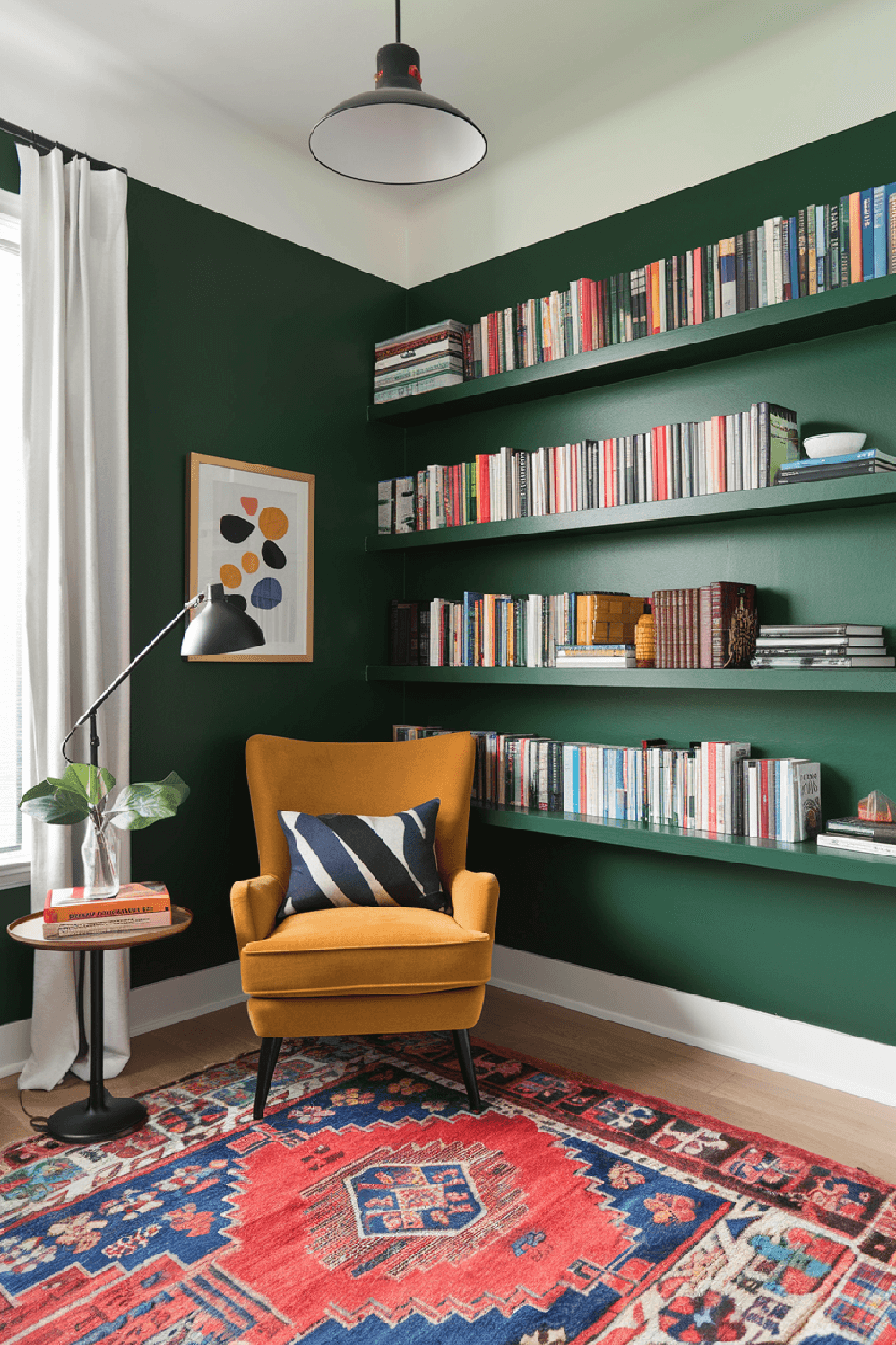 This green painted room is perfect to relax and sit in the gold chair to read.