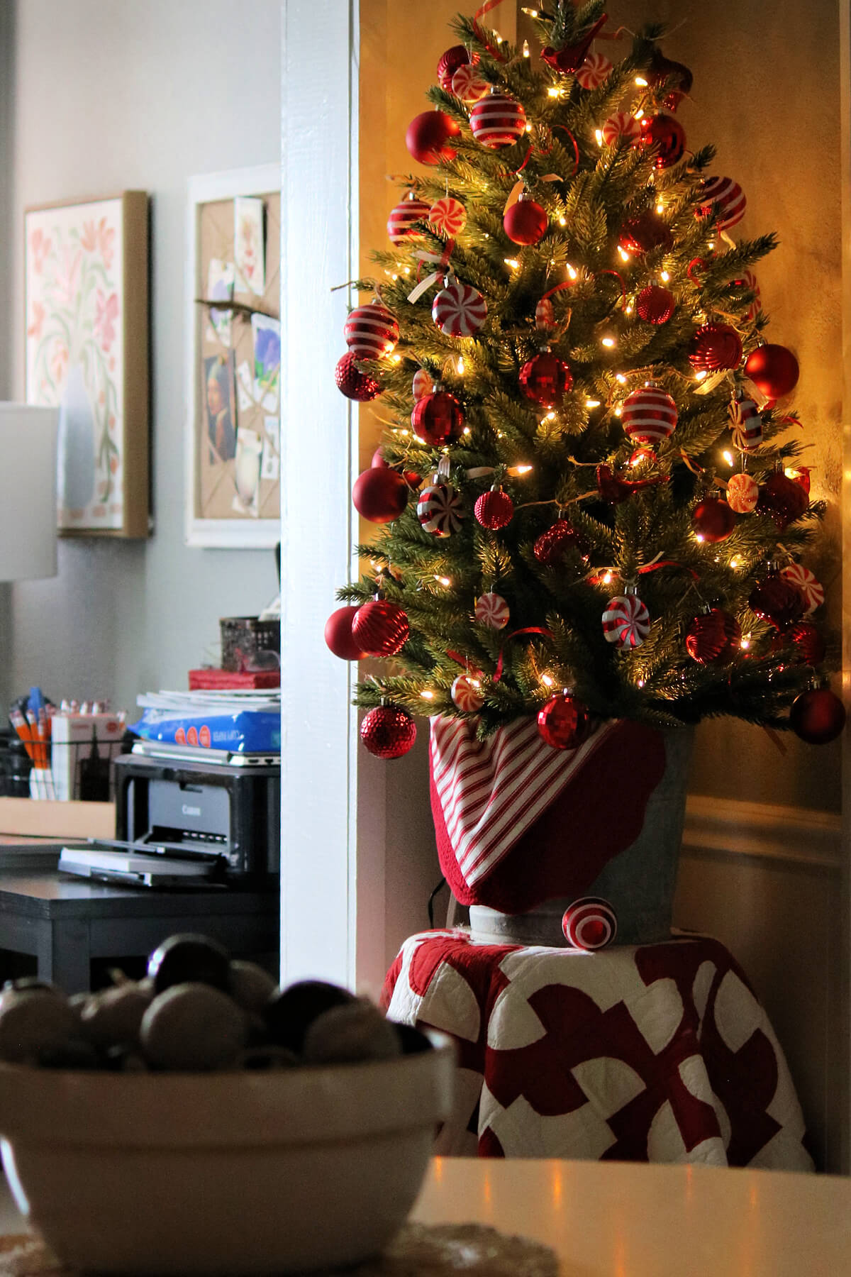 My Christmas tree with a quilt underneath, and the dining table with a vintage bowl of rag balls and bells.