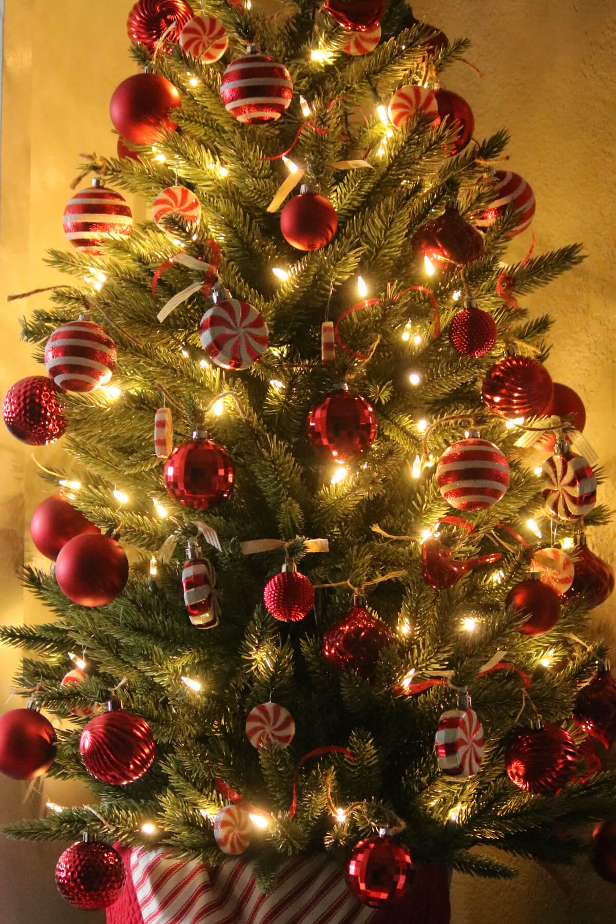 My tabletop Christmas tree with red and white decorations.