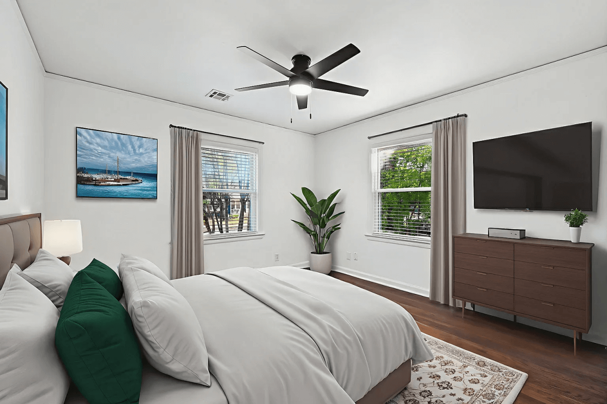 The master bedroom of this rental property has lots of natural light.