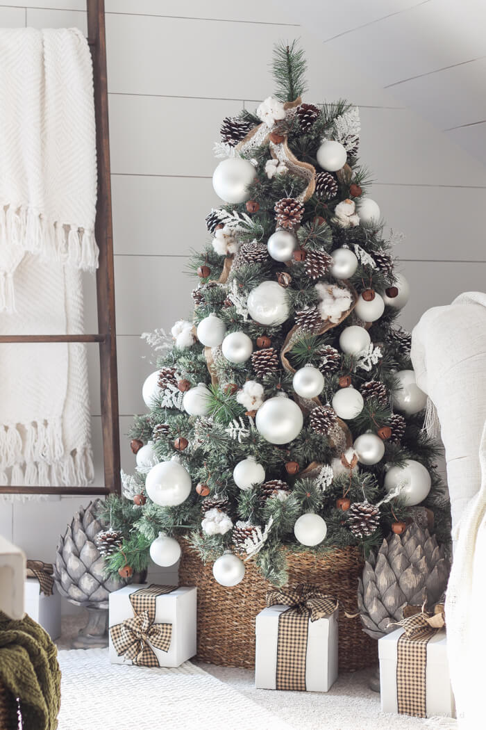 This tree would work for Christmas or winter with the pine cones and white ornaments.