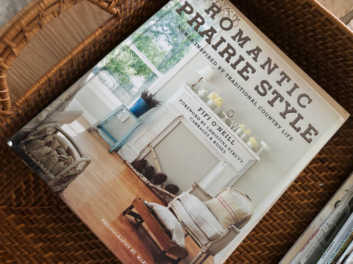 A rectangular basket filled with books.