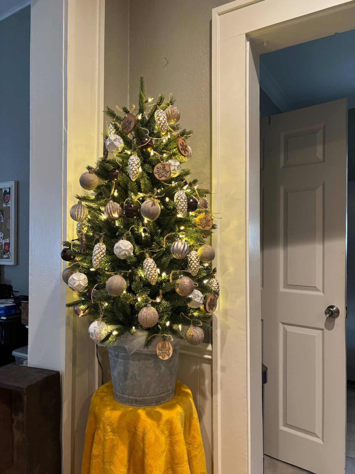 My winter Decorated Tabletop Tree sits in this little corner between the dining room and my small open office.