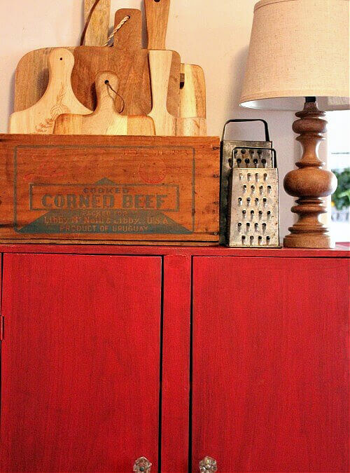 Storing cutting boards in a vintage box is one of my Easy Storage Ideas to Refresh Your Home.