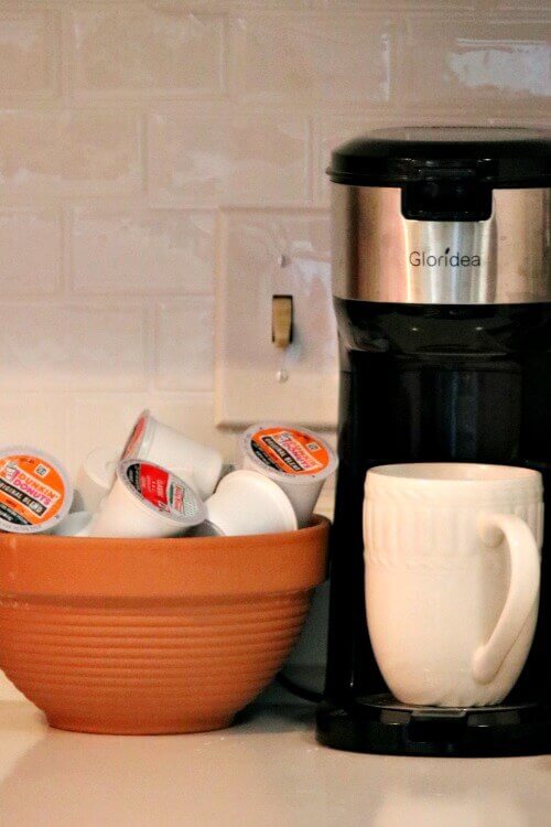 Storing coffee pods in a terra cotta bowl is an Easy Storage Ideas to Refresh Your Home.
