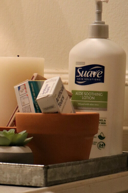 Using a terra cotta pot for bathroom storage.