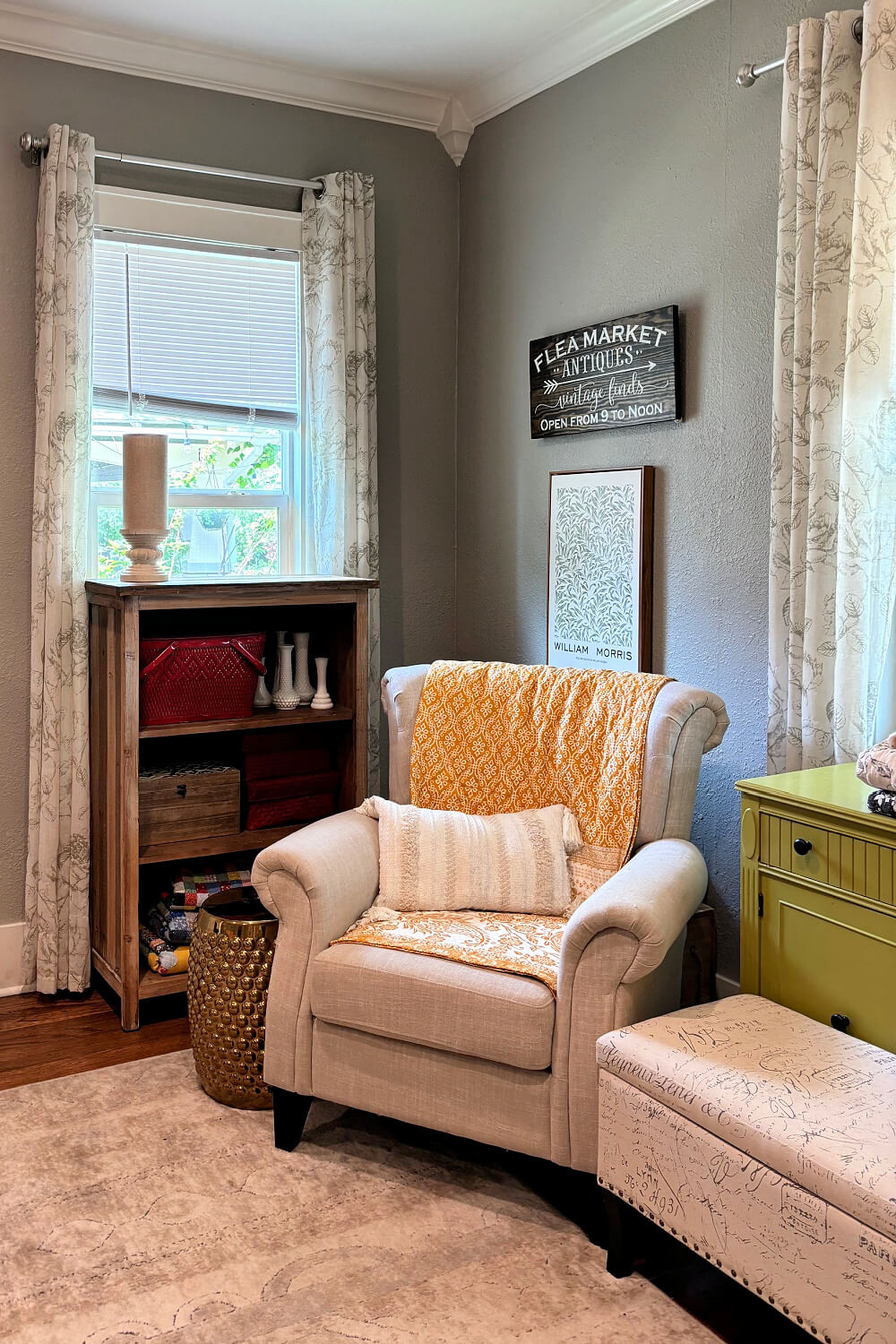 The beige chair with a boho yellow-gold quilt.