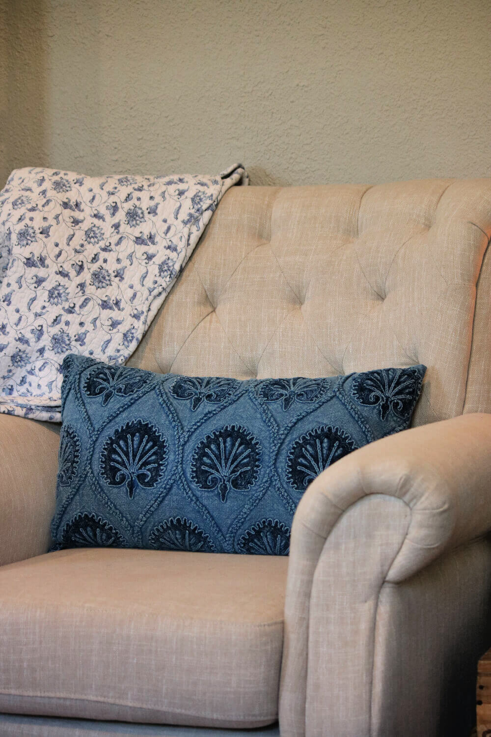 The easiest way to refresh your space is by changing small things like this blue pillow.