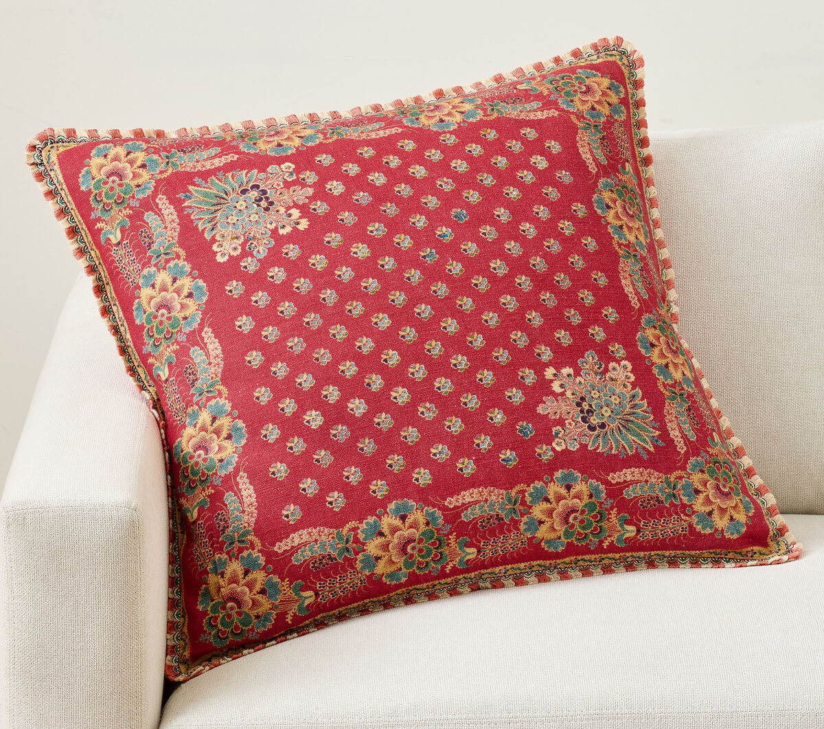 In how to use red in your home might be by using this scalloped flange pillow from Pottery Barn.