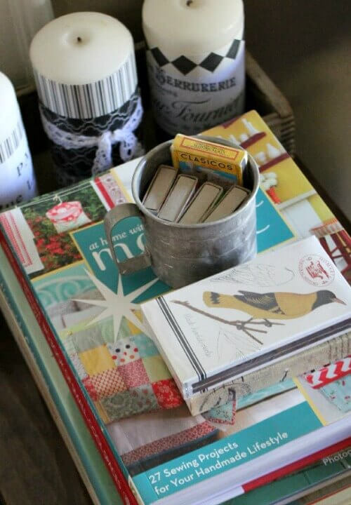 Put decorative vignettes on display with a stack of decorating books, and matchbooks.