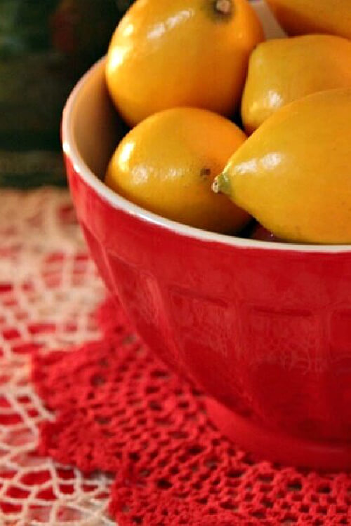 A red bowl, like this one I found at Pier 1 long ago, looks spirited with yellow lemons inside.