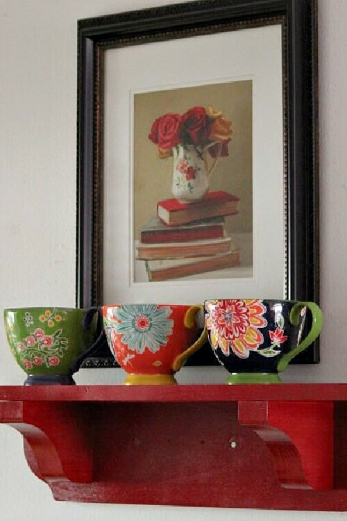 Add touches of this color in a painting, as well as a shelf with coffee cups.