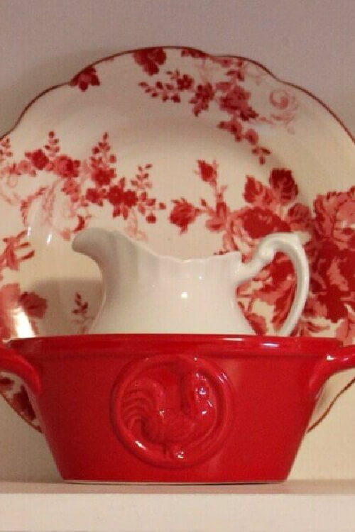 Red and white dishes in a kitchen.