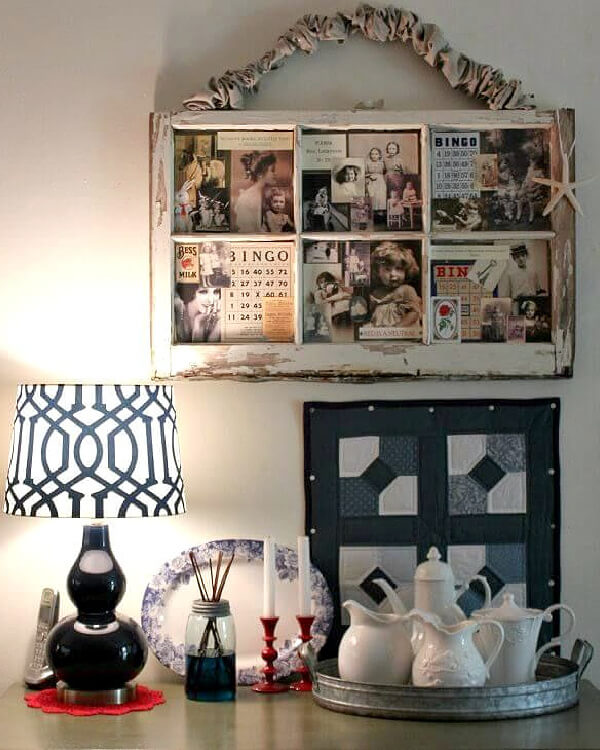 Put decorative vignettes on display by using the same color on each end for balance. A navy lamp, and a tray of white pitchers against a blue and white mini wall hanging.
