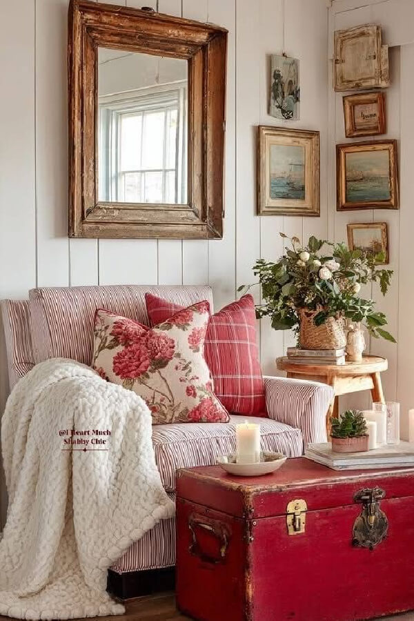 In how to use red in your home might include a bright red trunk used as a coffee table, with a red and white striped chair and several throw pillows.