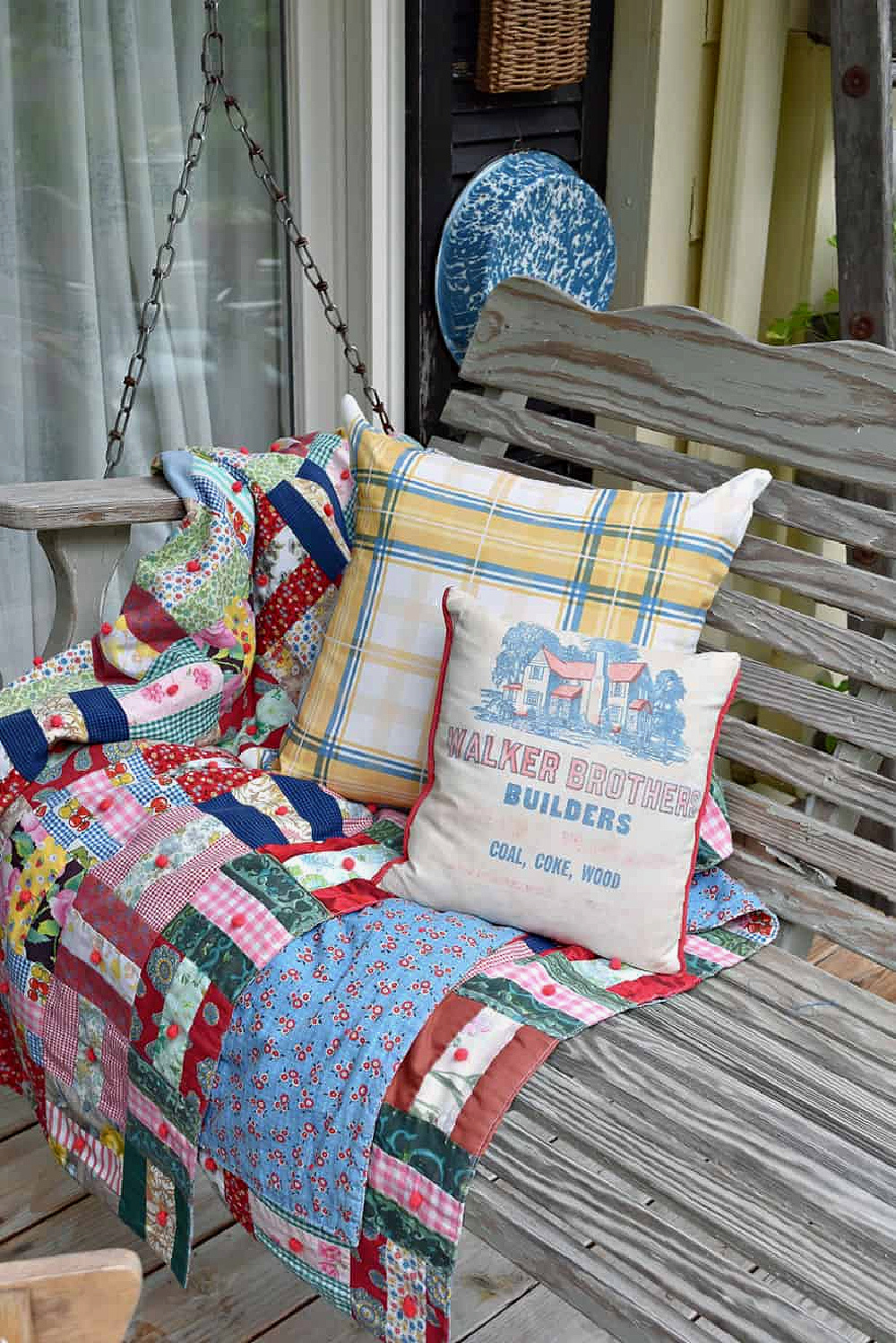 Americana-style with patchwork quilt and pillows.