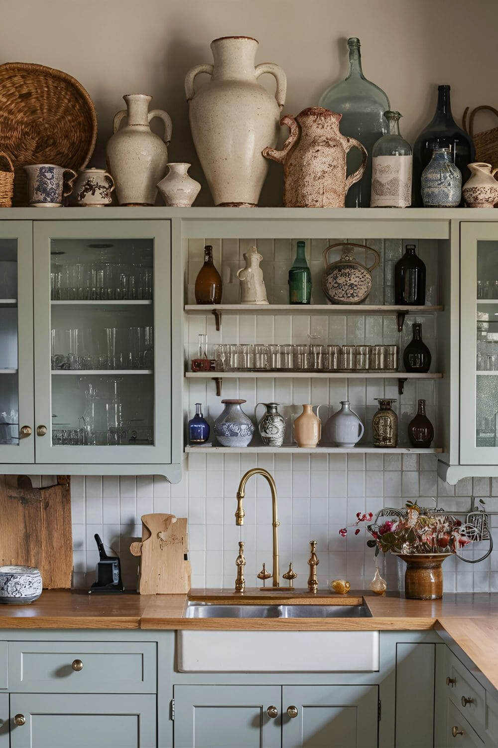In how to style space above kitchen cabinets, this resident used collected finds.