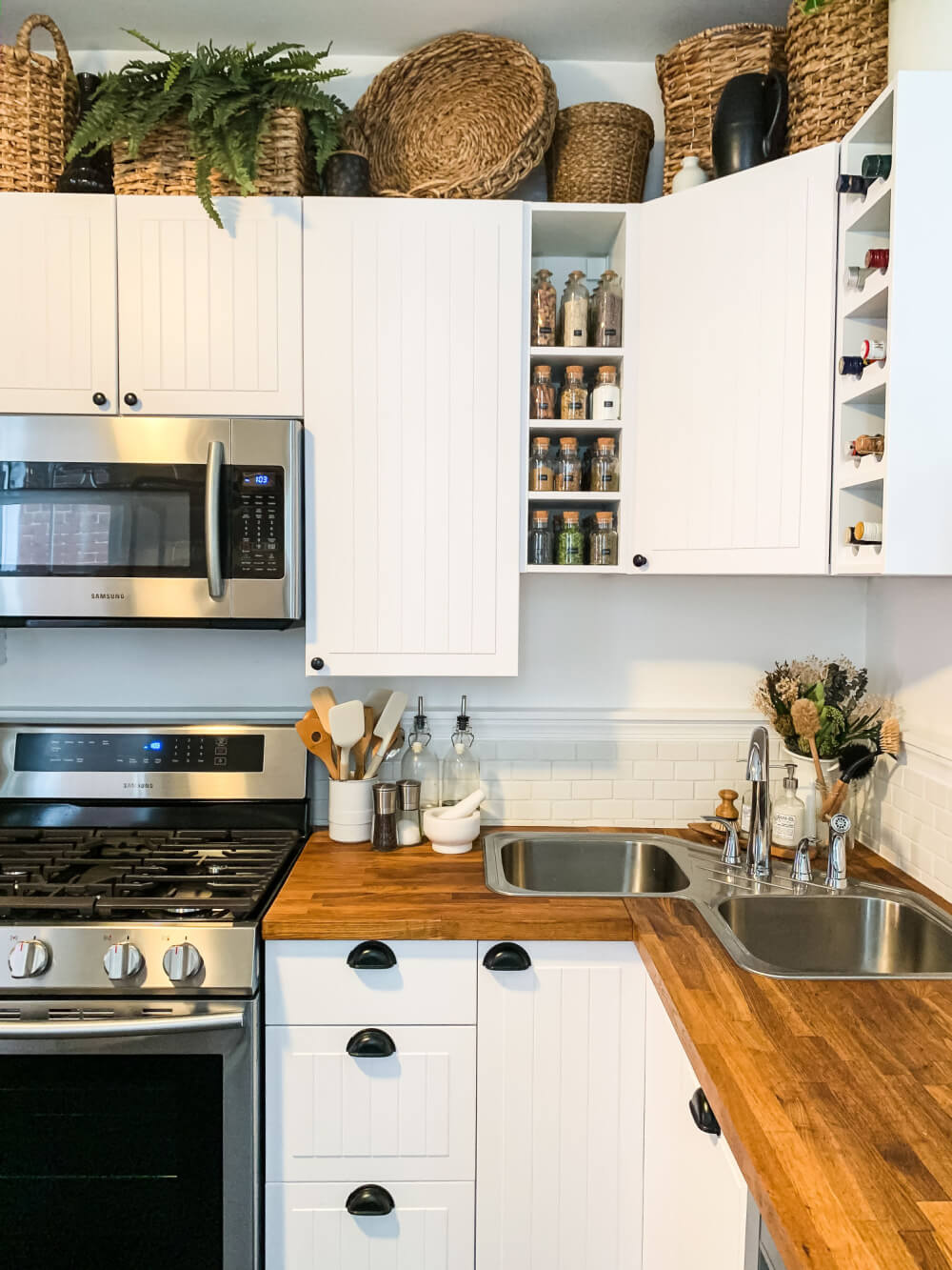 Baskets above cabinets.