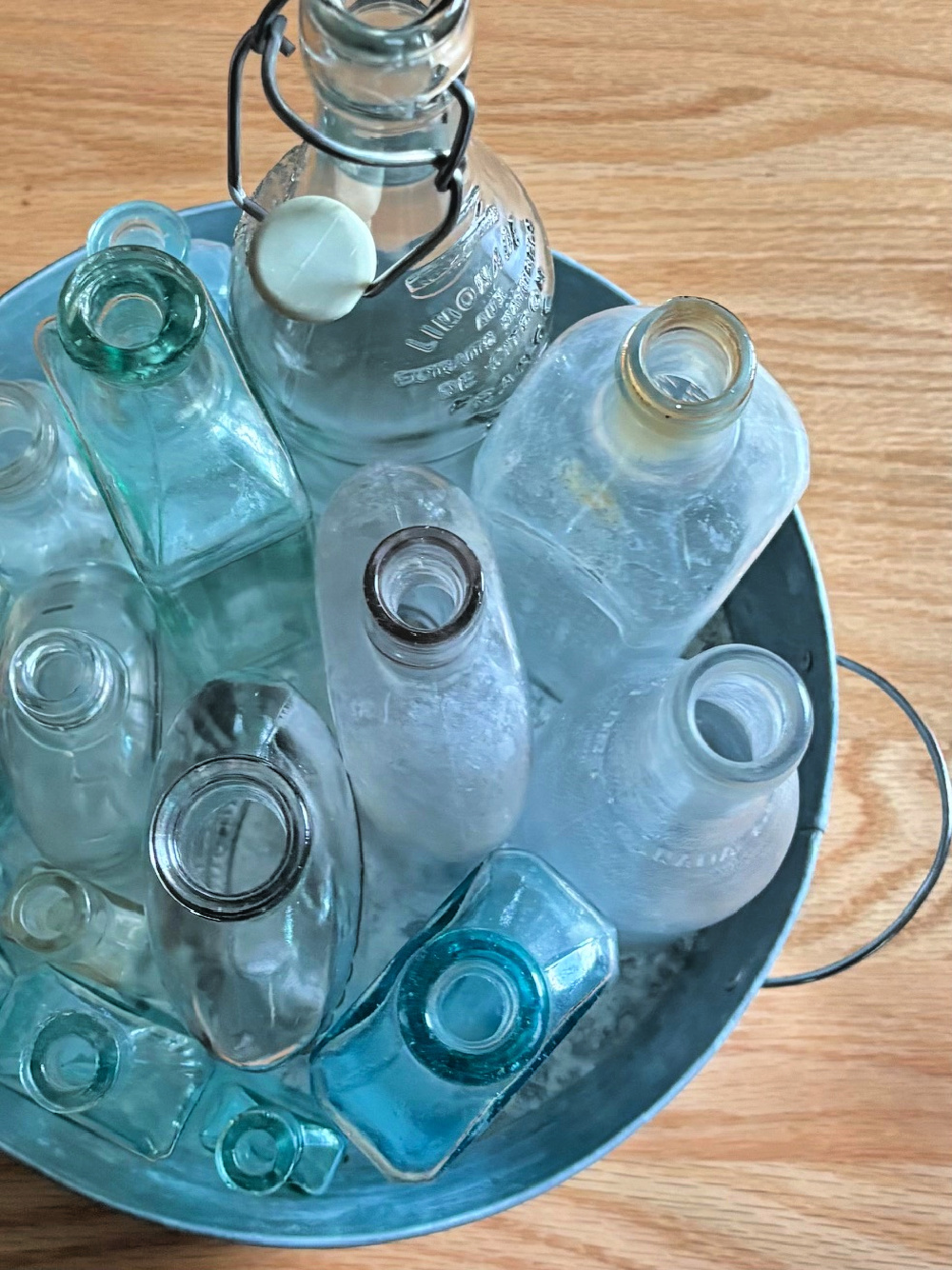 When decorating with vintage treasures, look for old bottles to collect.