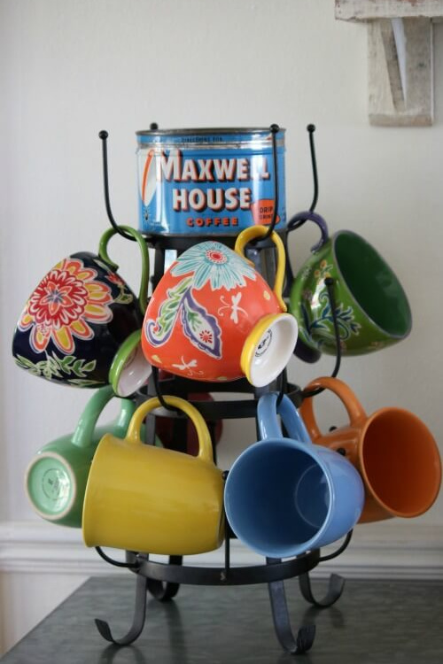 Colorful mugs look great when paired with a vintage advertising tin.