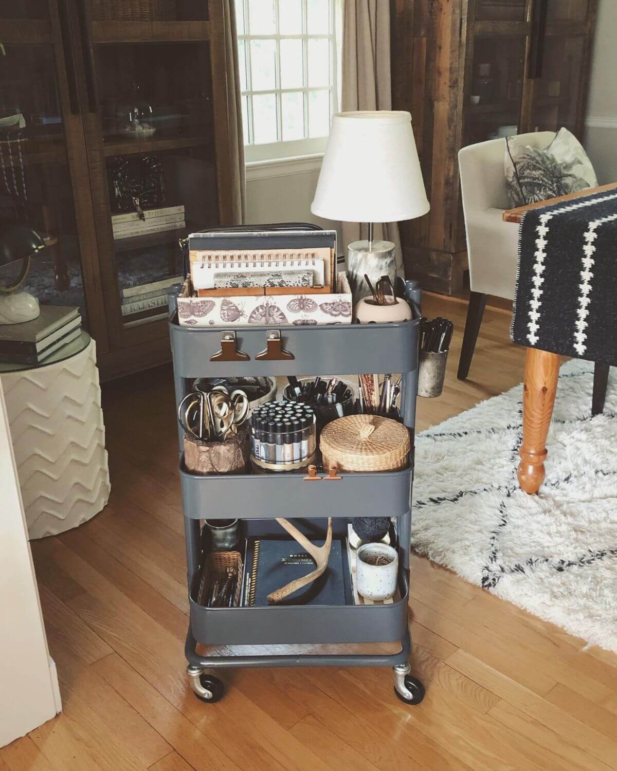 Office supplies next to a small lamp.