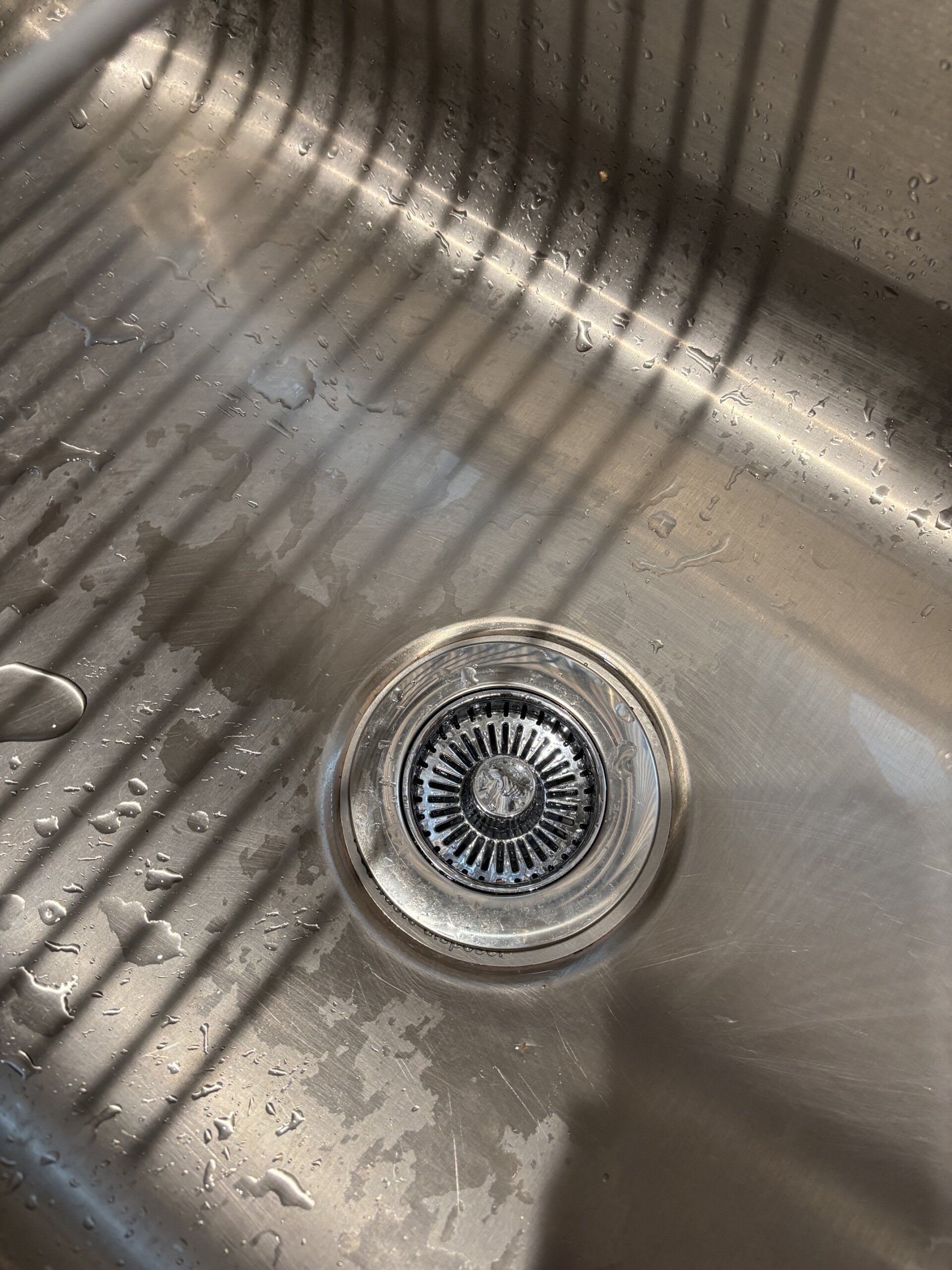 Refresh Your Kitchen with a Simple Color Switch like adding a new sink drainer.