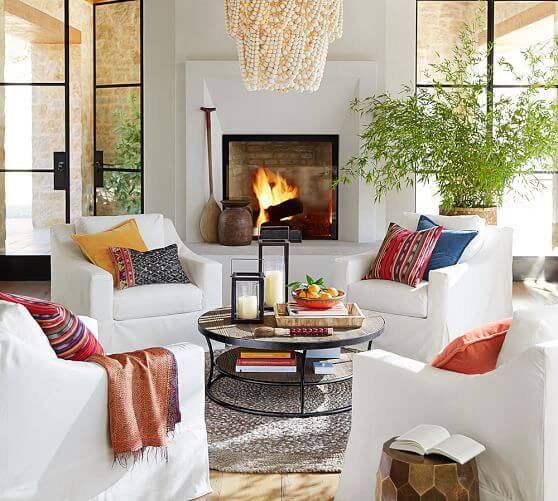 How to create zones in a room could be by arranging a conversation area with four chairs.