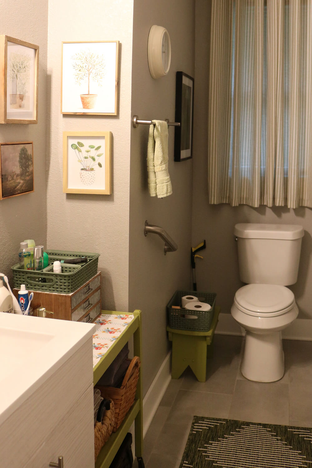 My bathroom after I reorganized it with cheap plastic storage boxes.