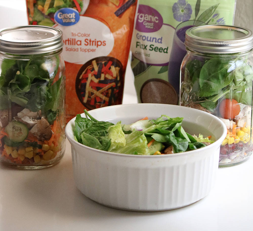 The salad I prepared plus two jars of salad for the next two meals. i also added tortilla strips and ground flaxseed.