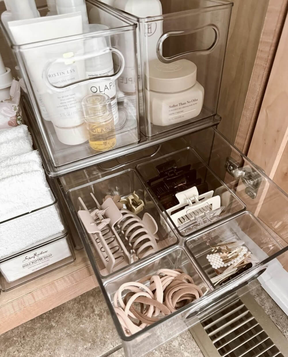 Clear storage under a bathroom vanity.
