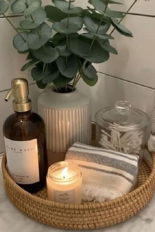 Use a wicker tray to corral bathroom items.