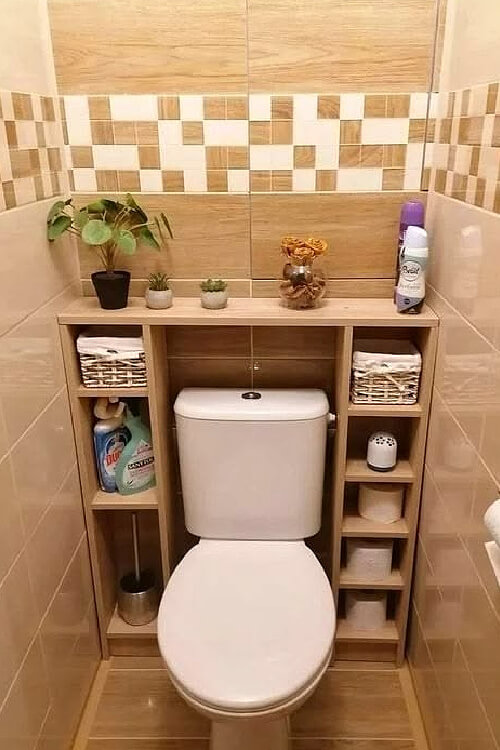 In 26 Bathroom Storage Ideas for Small Spaces, build wooden cubbies around the toilet.