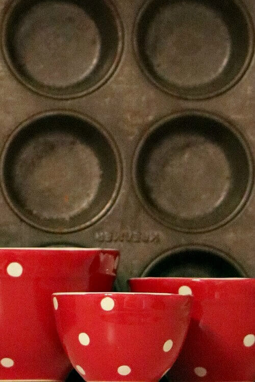When decorating with vintage treasures, I always like to pick up vintage muffin tins for votive candles.