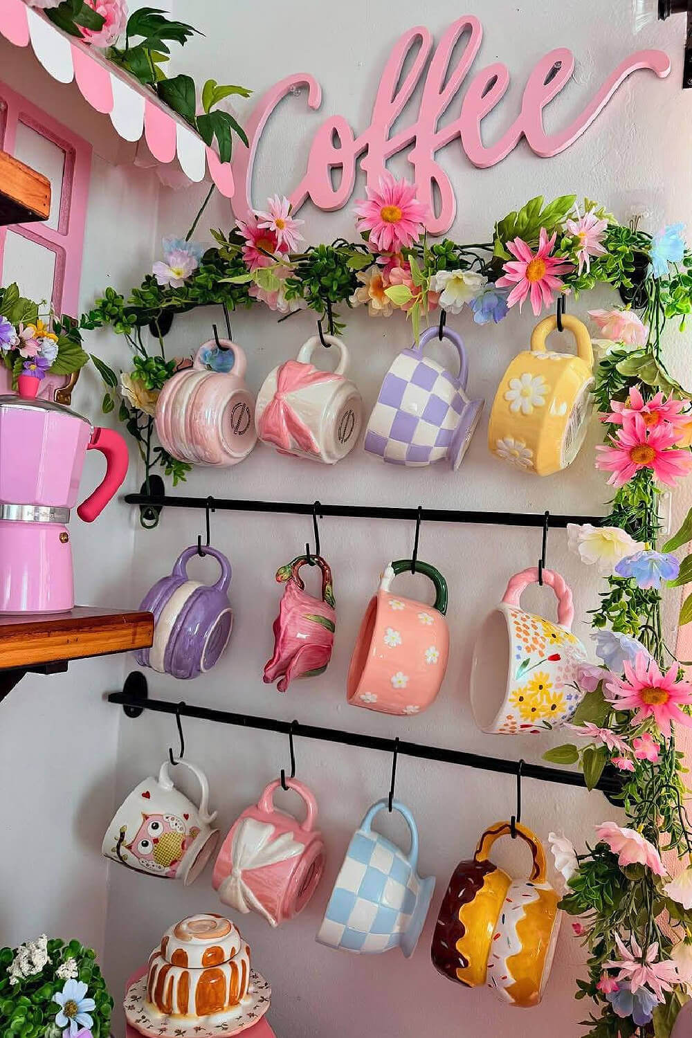 Cups attached to and hanging on the wall.