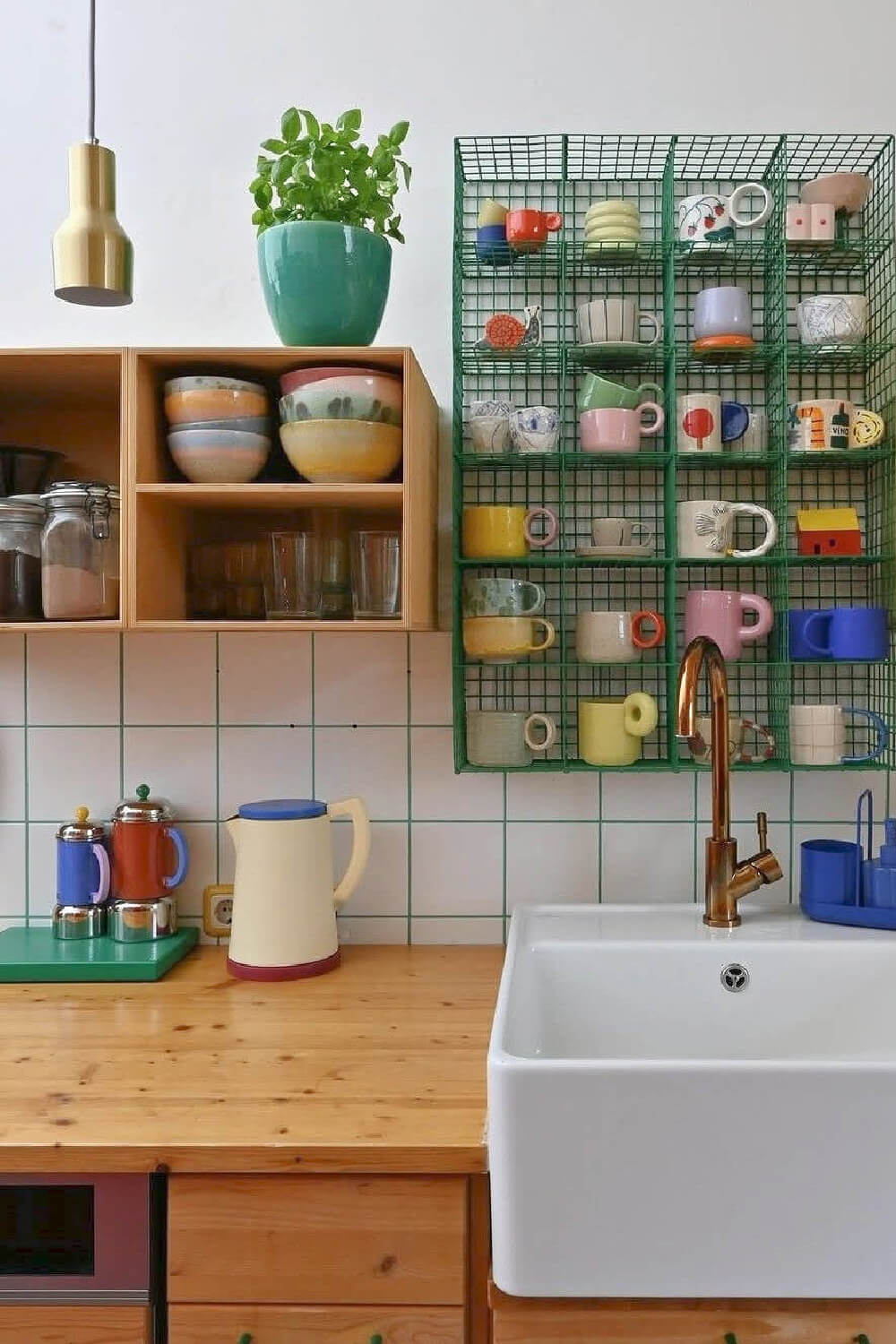 25 clever ways to display coffee mugs include this metal cubby shelf on the wall.