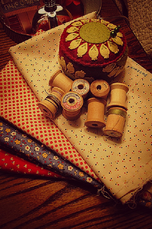 Vintage jars full of twine and button cards and Scrabble pieces.