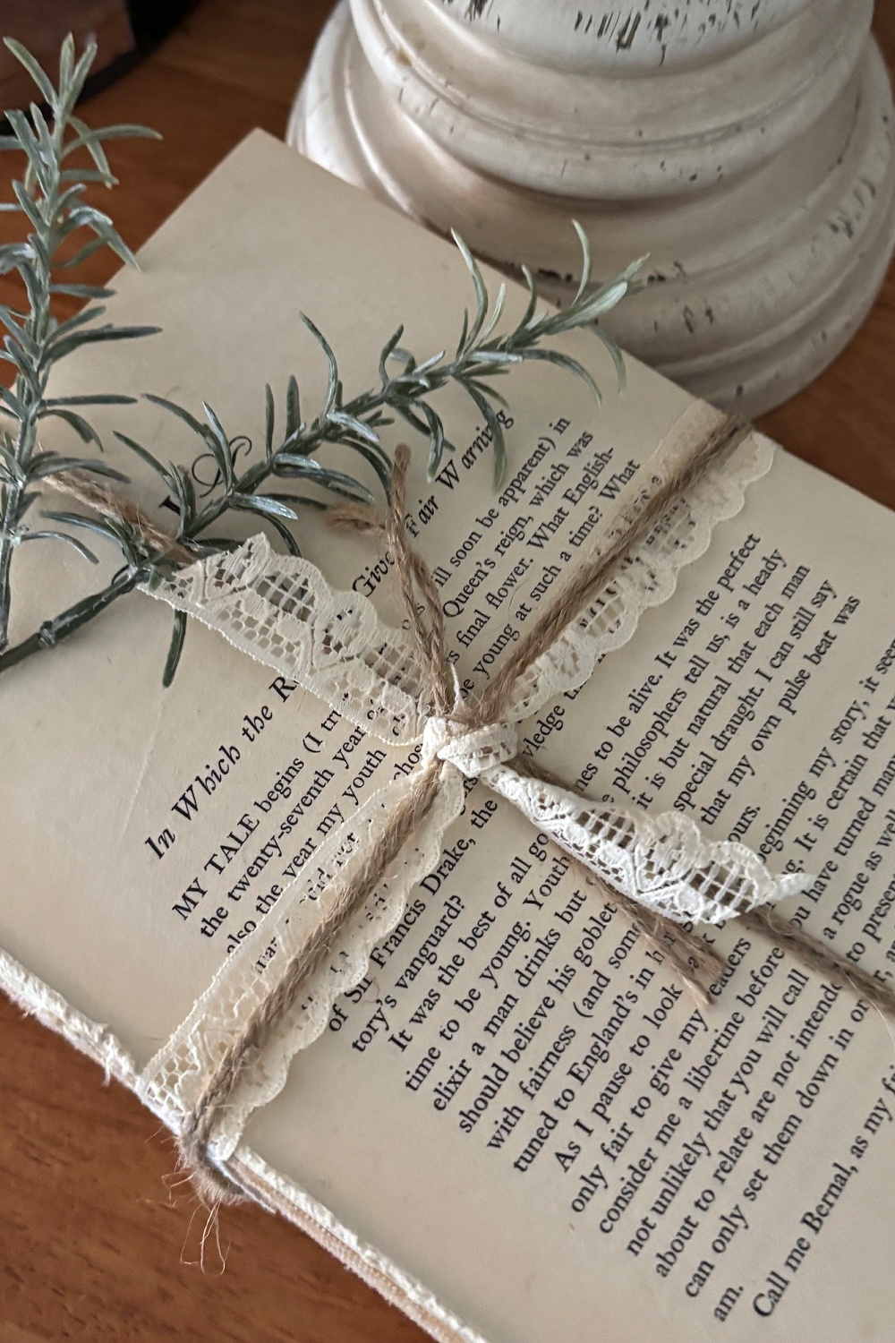 Create an Airy Living Room with Easy Decorating Tips by taking the front and back off old books to create a more relaxed feel. Add a sprig or two of rosemary.
