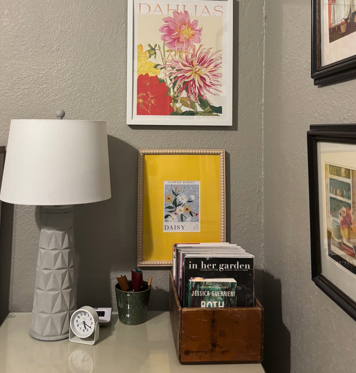 The side of the bed closest to the door. These are floral paintings I've collected.