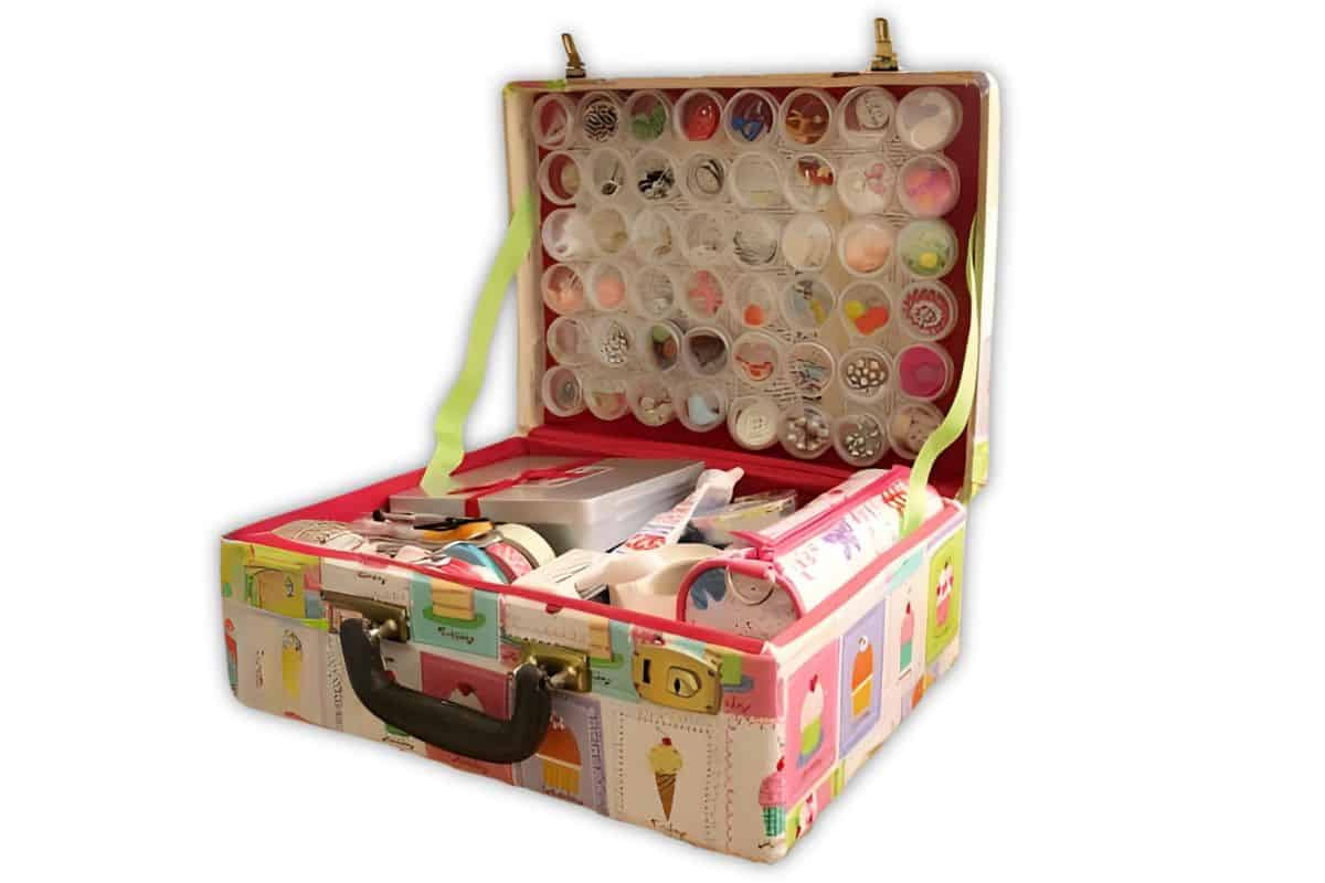 22 ideas to repurpose vintage suitcases includes this craft supply storage.