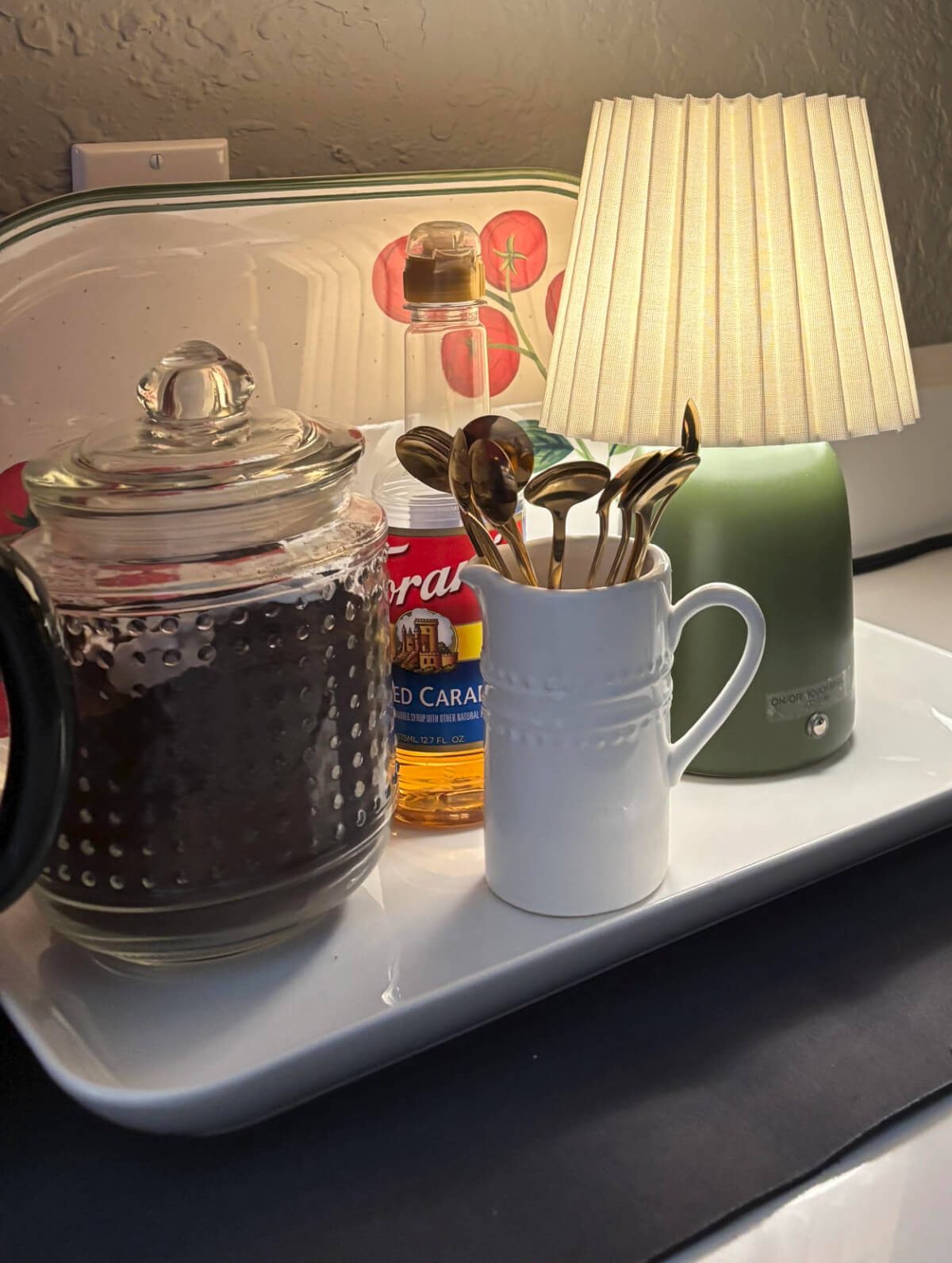 The rich colors of fall in my kitchen include this coffee area on my countertop with coffee and syrups.